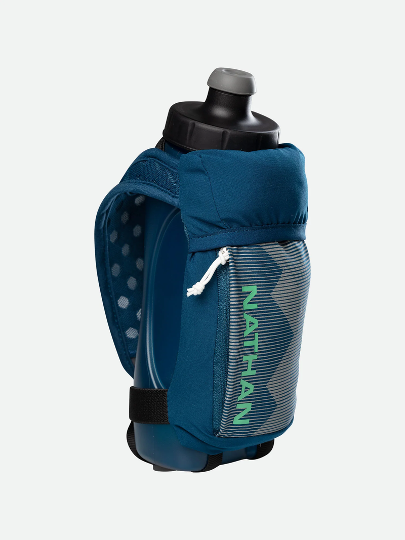 Load image into Gallery viewer, a person in a blue jacket is holding a snowboard