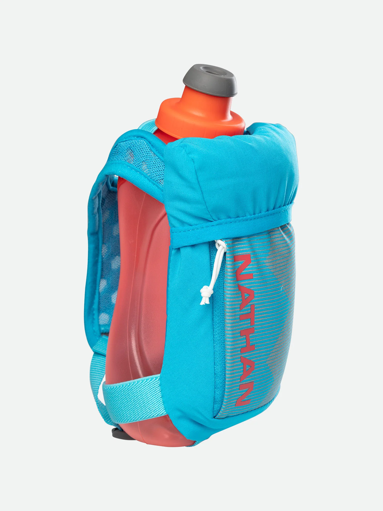 a person in a blue jacket holding a suitcase 
