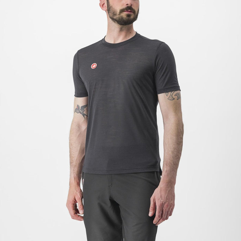 Load image into Gallery viewer, a man standing in front of a white wall 

