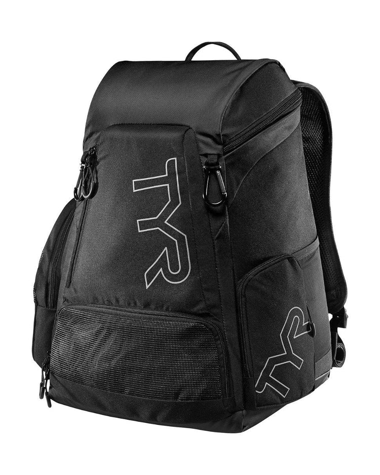 a black suitcase with a backpack on it 